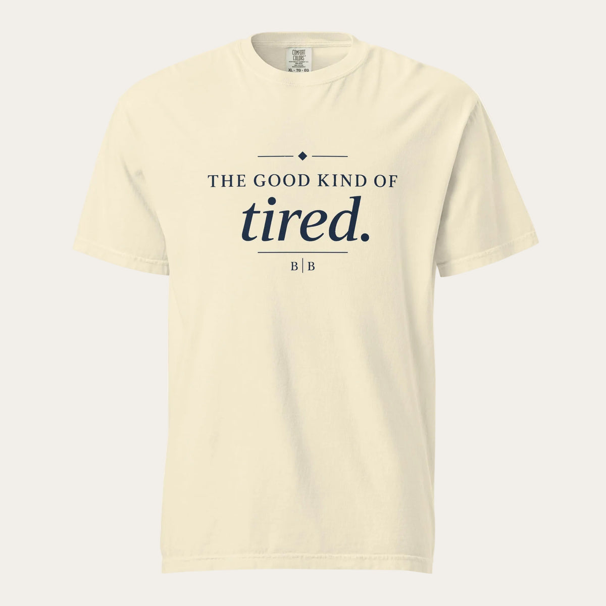 The Good Kind of Tired cream garment-dyed T-shirt front view